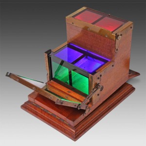 a picture of a Kromskop device, with the red, green, and blue glass colored filters visible.